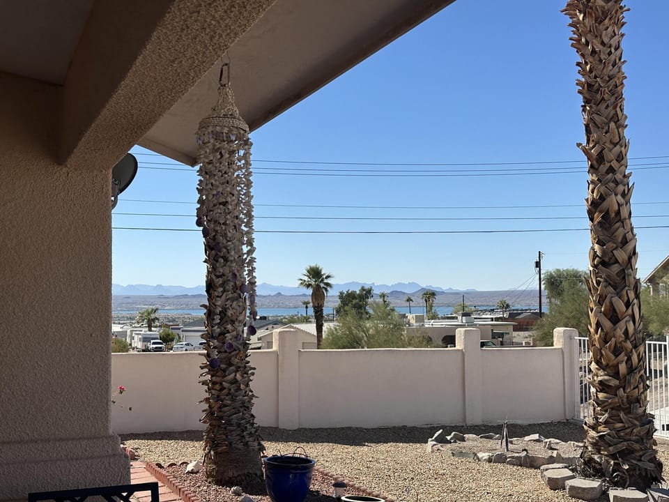 Relax on the shaded patio with stunning lake views