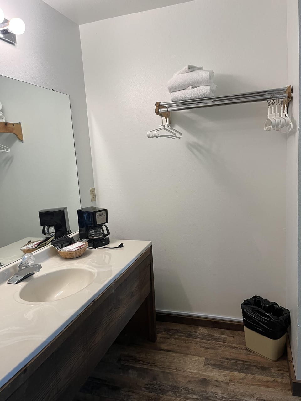 Modern bathroom with sleek countertop and ample lighting