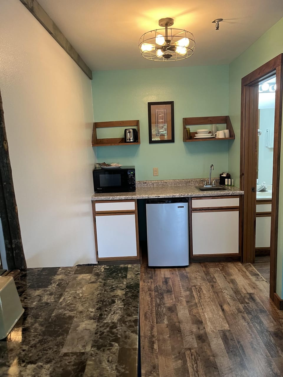 Cozy kitchenette with modern amenities and rustic charm