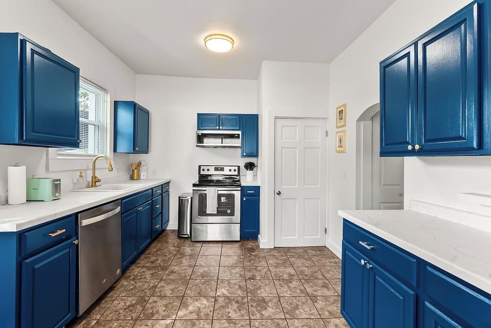Spacious white counters make this kitchen ideal for cooking memorable meals to share with your whole group.