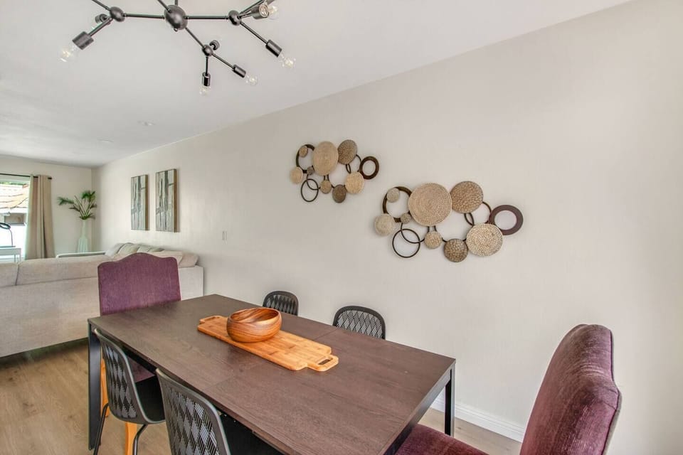 Stylish dining area with warm lighting and artistic wall accents