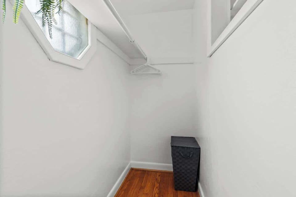 A clean, minimal space perfect for storing luggage or personal belongings.