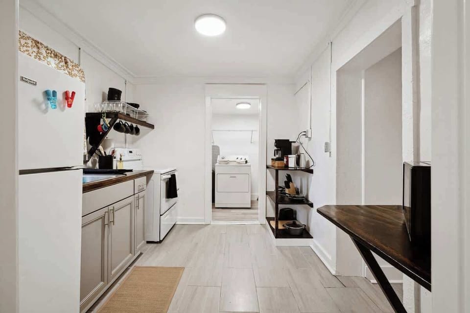 Compact kitchen w/ appliances, shelving & everything within easy reach