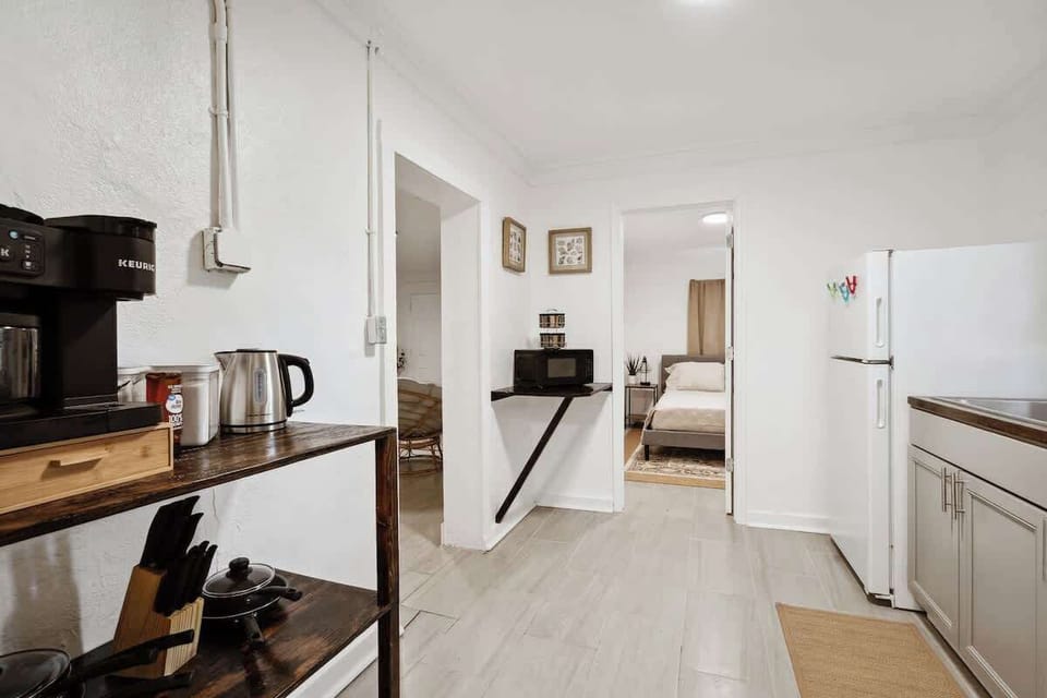 Open kitchen w/ sleek counters, appliances & a bright, airy layout