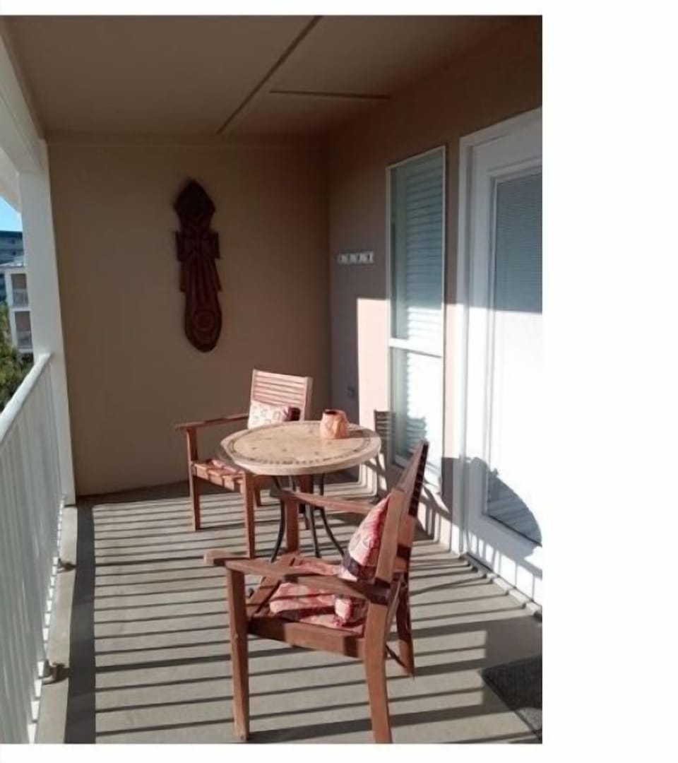 Bright terrace over looking the pool, hot tub and gulf.