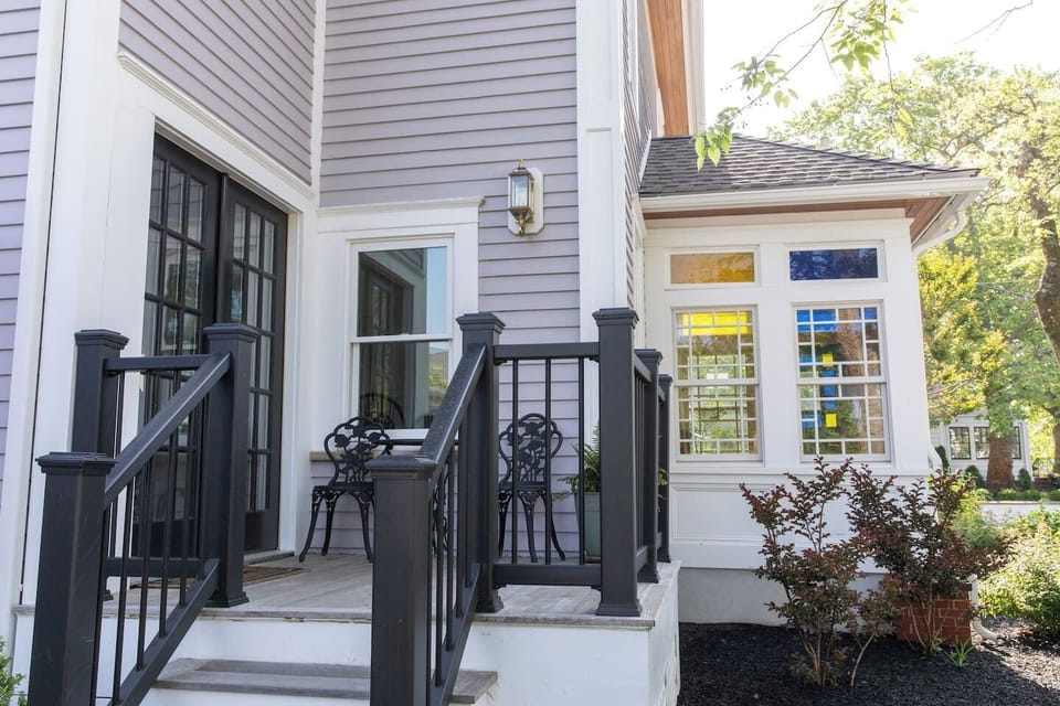 Main Entrance With Small Deck and Outdoor Seating