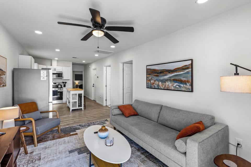 Open-concept living room with smart TV and comfy seating.