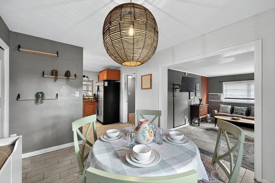 Open concept living with fully equipped kitchen, dining area, and entertainment