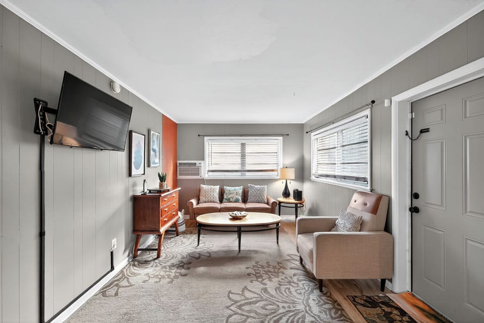 Welcoming living area with cozy seating, entertainment, and climate control