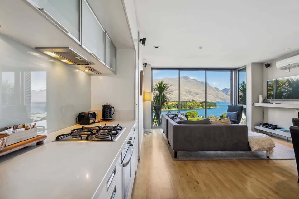 Cook, dine, and relax in this open space with seamless flow from kitchen to lounge and out to incredible views.