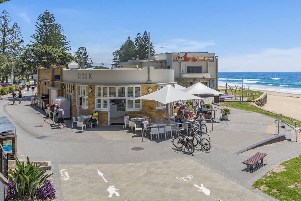 Start your day at Wollongong Beach, where local cafés and seaside paths meet golden sands and ocean views just moments from the shoreline.