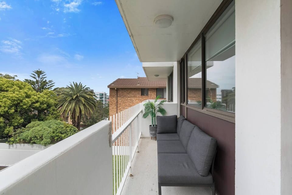 Unwind on the breezy balcony lounge surrounded by treetop views, ideal for reading or sunset drinks in the fresh coastal air.