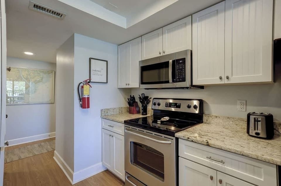 Modern kitchen with stainless steel appliances and granite countertops