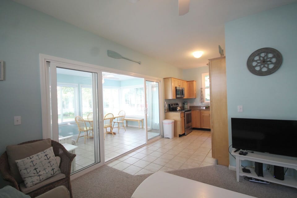 View of sunroom and kitchen from the living room