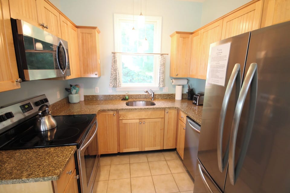 Kitchen with granite counter tops and stainless steel appliances