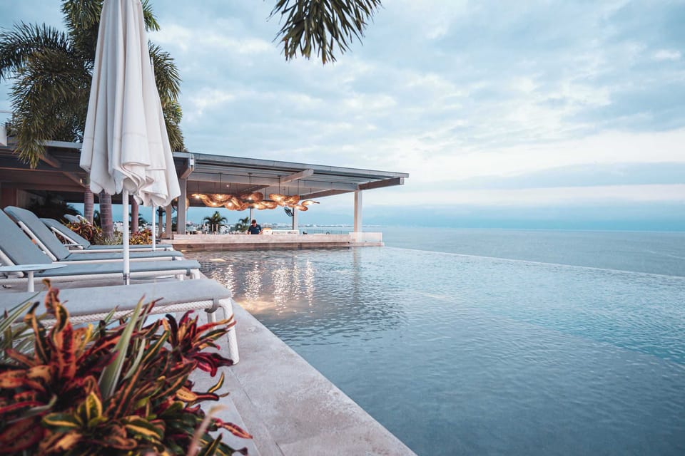 Rooftop infinity pool with swim up bar. Premium drinks and guest friendly prices (beers from $40mxn, carajillos at $75mxn, margaritas at $90mxn)