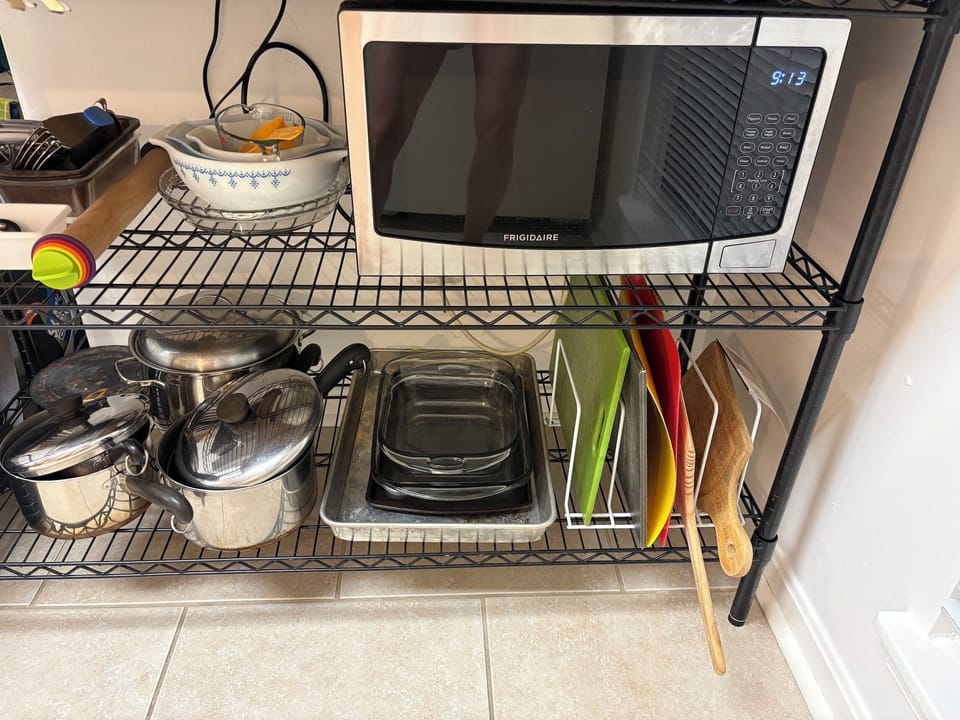 Microwave, toaster, and many cooking essentials. 