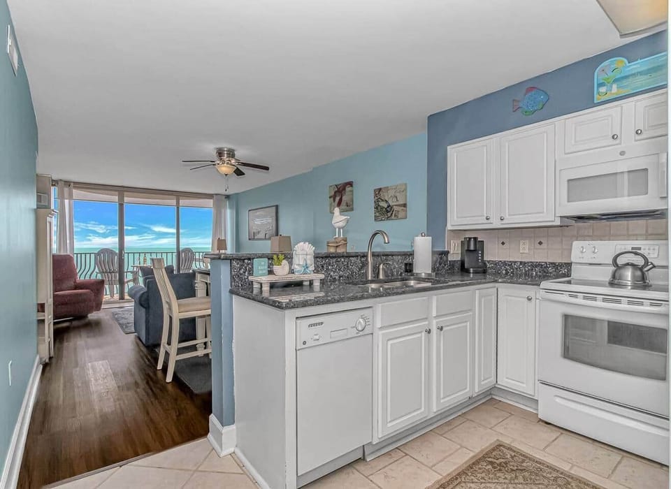 Enjoying cooking meals with Beautiful Oceanview's from the Fully Equipped and stocked Kitchen!