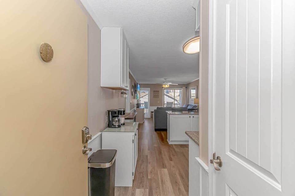 Unit entryway featuring a keyless lock for easy entry and new LVP flooring!
