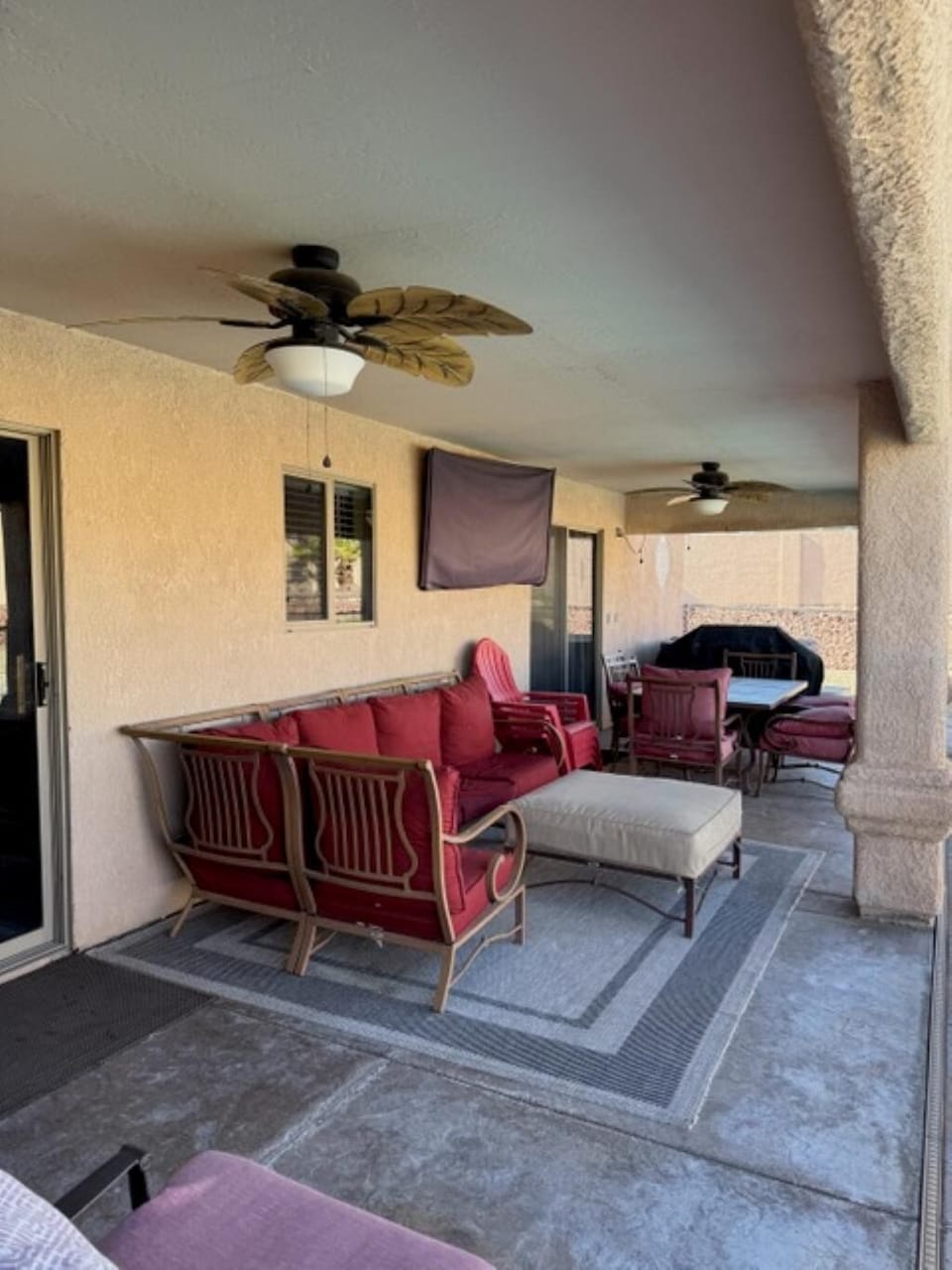Spacious covered patio with cozy seating for relaxing gatherings