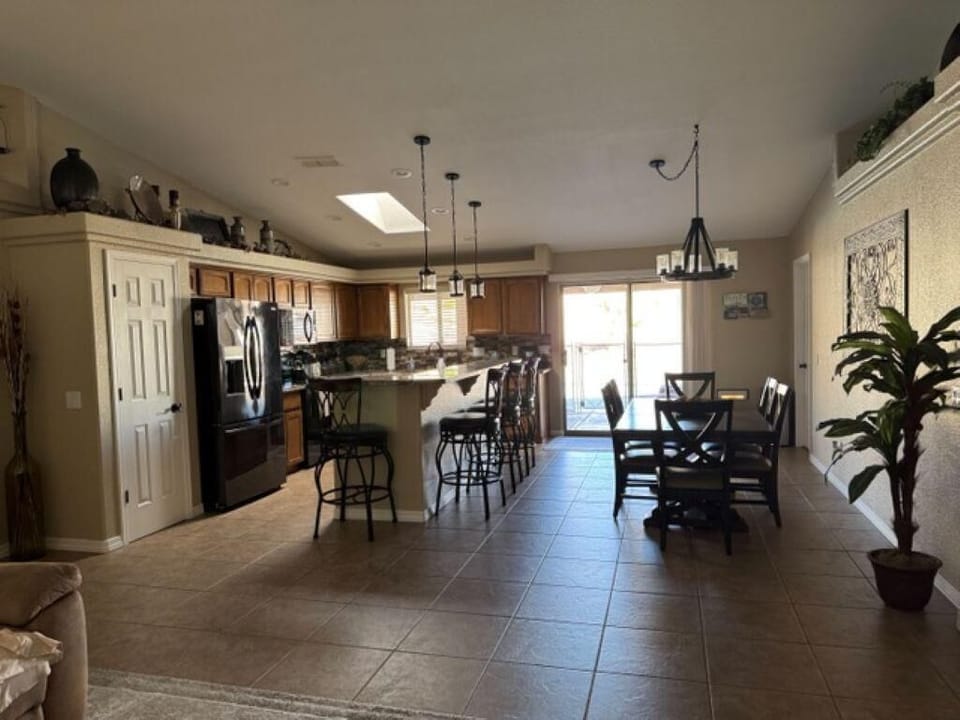 Spacious kitchen and dining area with natural light and modern amenities