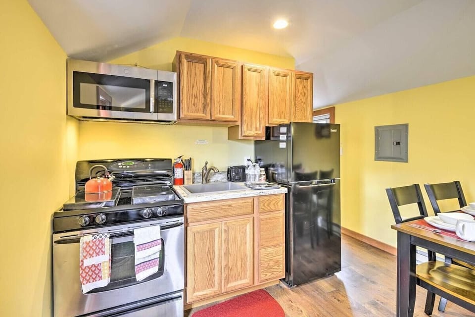 Cozy kitchen with modern appliances and warm wood cabinets
