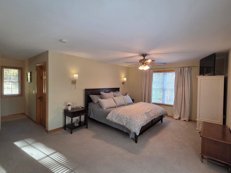 Private master with jetted tub, walk in shower and smart TV.