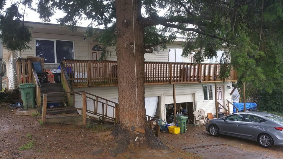 Property is on a sloping street. Front and rear deck entries are street level