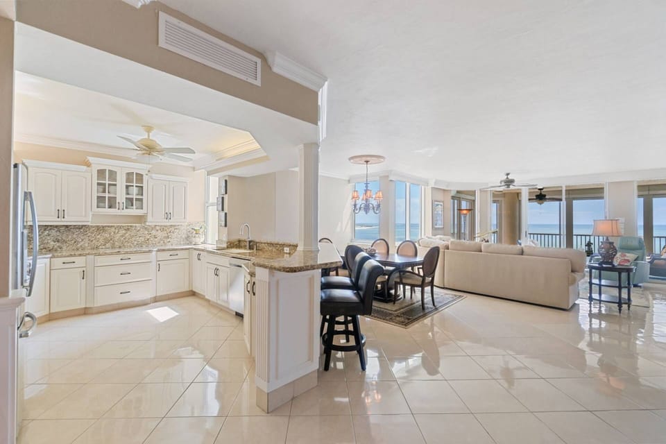 Spacious open-concept living with comfortable furnishings and sweeping views of the Gulf.
