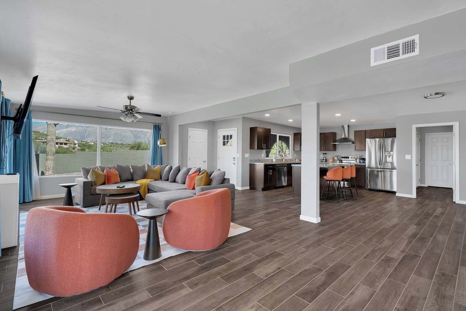 Kick back in a cozy living space featuring a soft sofa, streaming TV, and charming décor. The room’s warm lighting and welcoming vibe make it ideal for relaxing after a busy day of adventure.