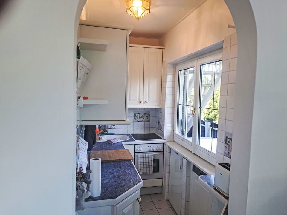 Interior Design, Flooring, Kitchen, Major Appliance, Floor, Countertop, Ceiling, Furniture, Cabinetry, Lighting