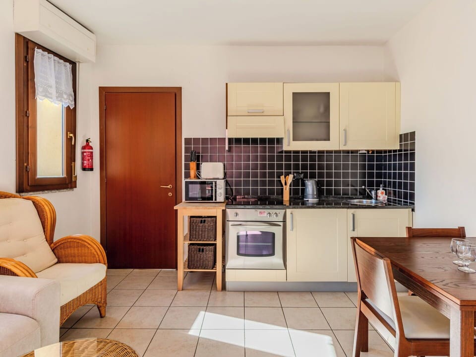 Furniture, Interior Design, Wood, Flooring, Floor, Room, Apartment, Chair, Ceiling, Cabinetry