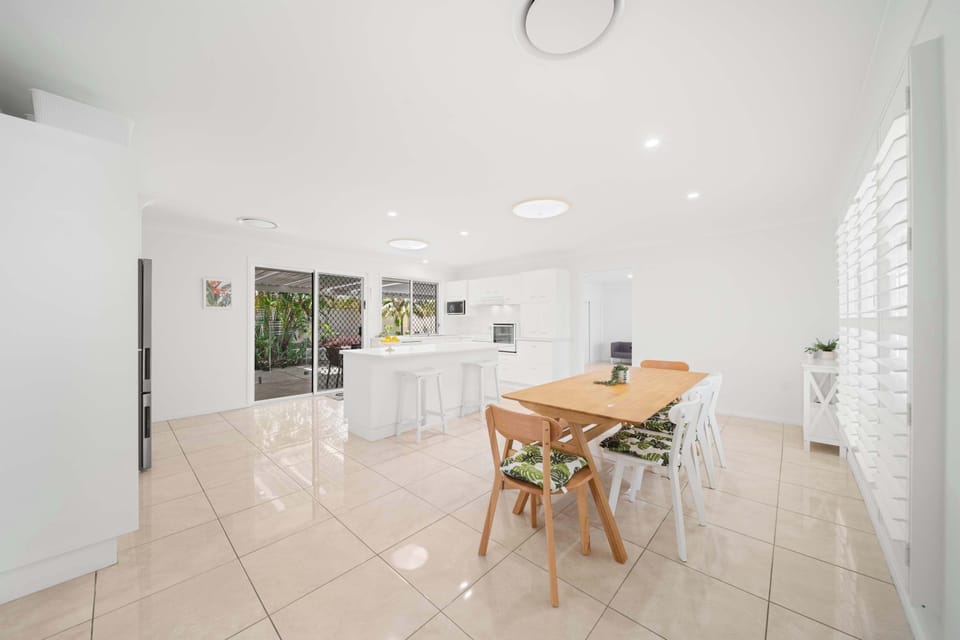 Stylish living area flowing seamlessly into dining and kitchen.