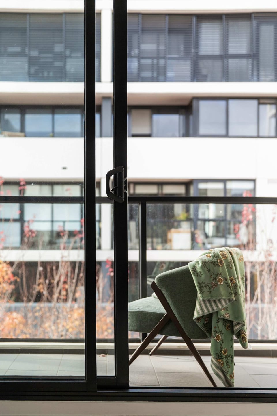 A balcony. *(Chair in balcony is from the living room for photography purposes)