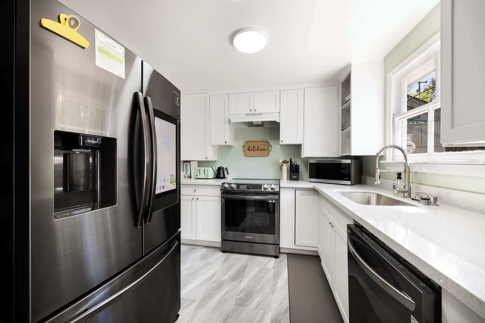 Fully equipped with stainless steel appliances and sleek finishes.