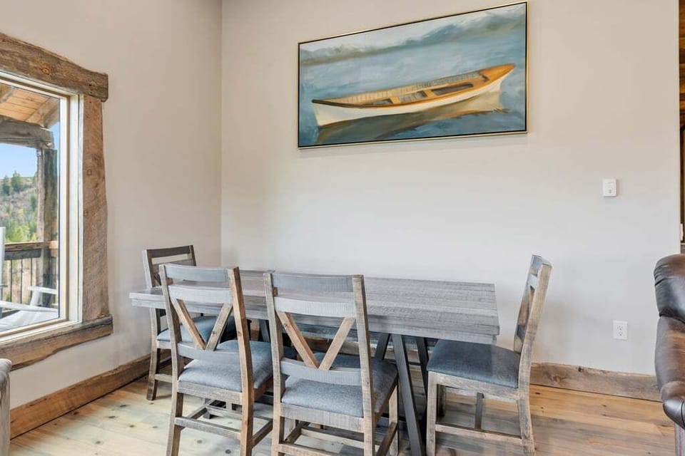 Gather around your dining table for memorable meals, where rustic charm meets modern comfort in this inviting space.