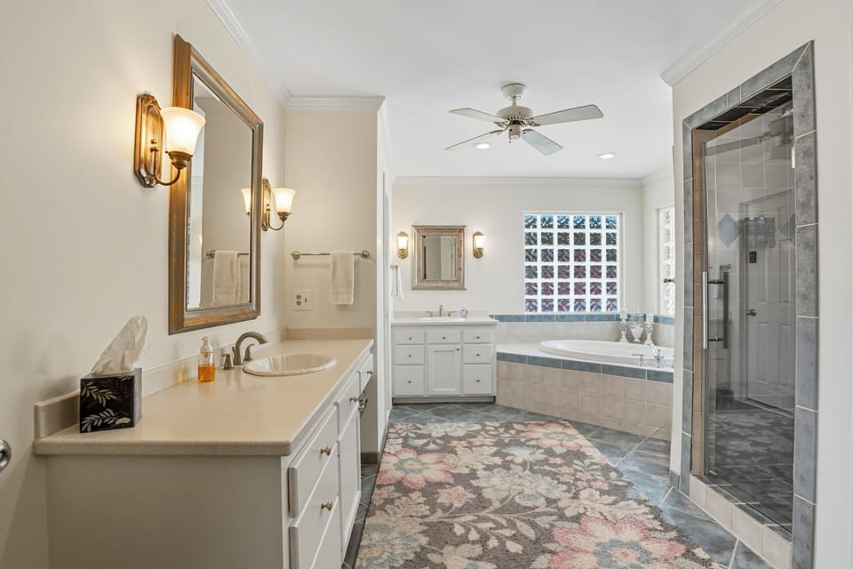Primary Bathroom – 4326 12th Street - Large ensuite with dual vanities, soaking tub, and walk-in shower—bright finishes and thoughtful design create a true primary suite experience.