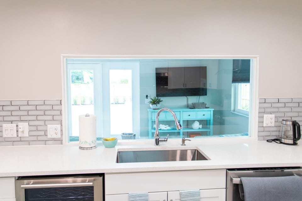 Chef's kitchen overlooking enclosed and private lanai
