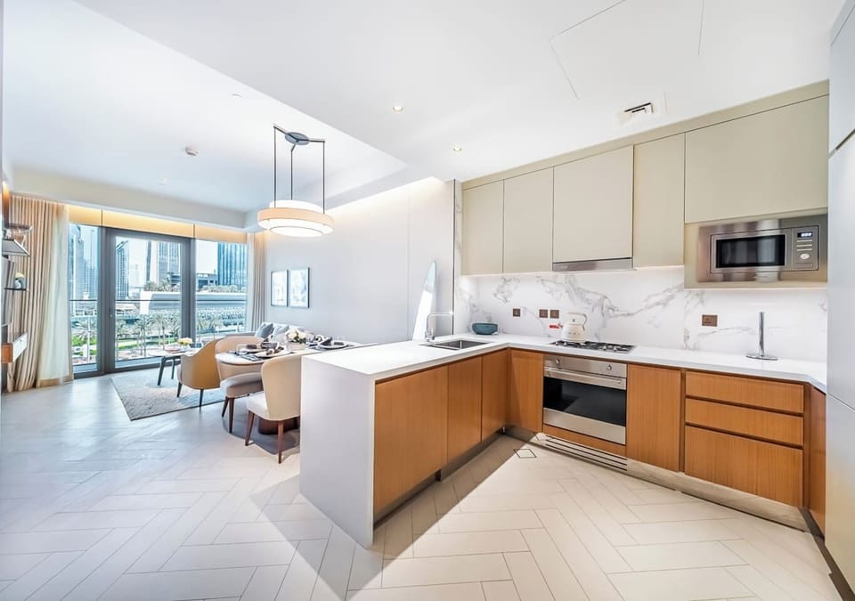 Gourmet kitchen flows effortlessly into the elegant dining space.