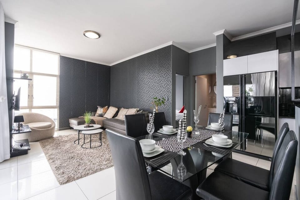 Elegant Dining Area: The Heart of Your Social Space.Gather and connect in the elegant and centrally located dining area, the perfect setting for a memorable meal, a quick breakfast, or a collaborative workspace.
