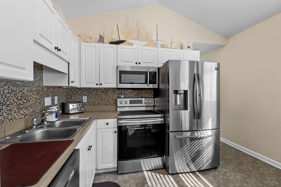 Modern kitchen with stainless steel appliances and ample storage