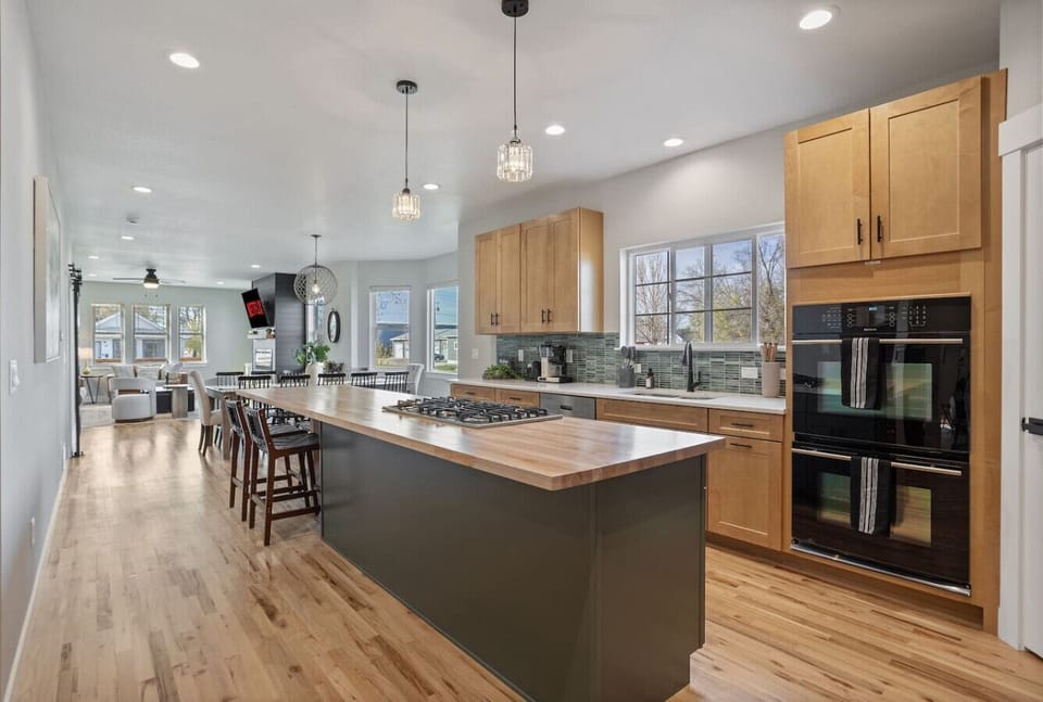 Gas cooktop, double ovens, and grill for big group meals.