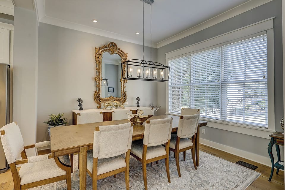 Dining table featuring 8 chairs.