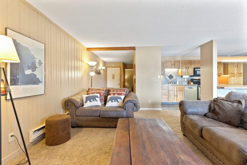 Living room with smart TV and gas fireplace.