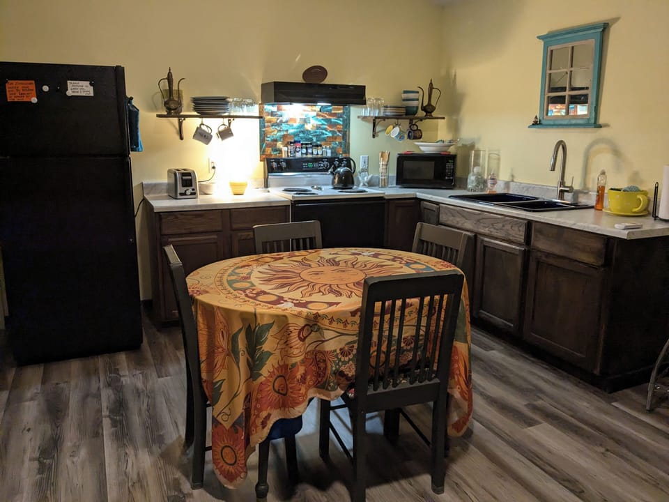 Full kitchen with refrigerator, stove, and microwave