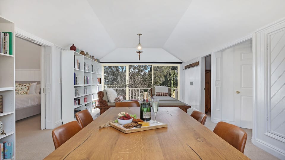 Southern Grace | Upstairs informal dining room | Book library | Balcony