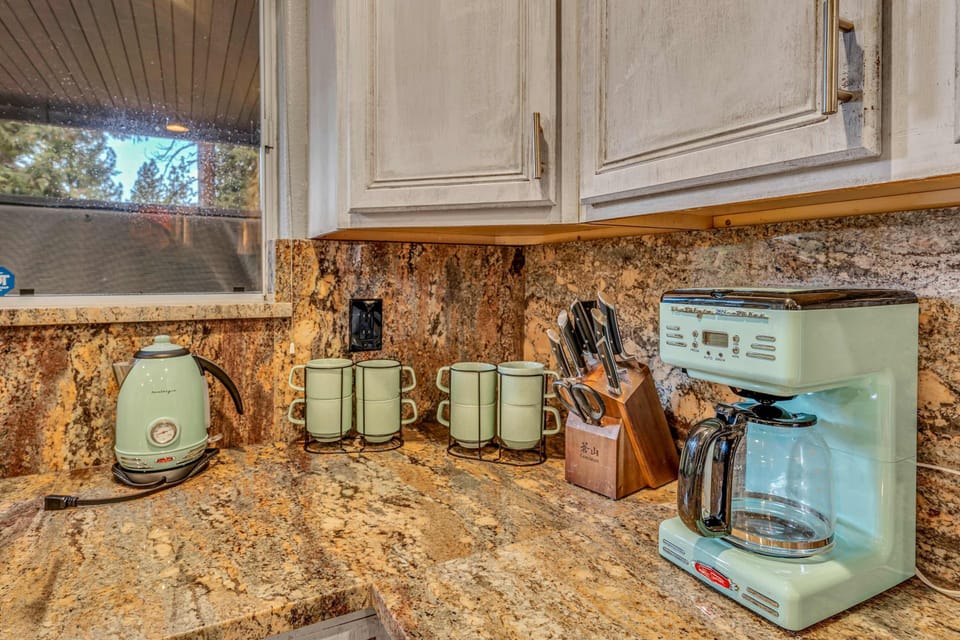 Kitchen: Drip coffee maker, air fryer, blender, kettle, cooking utensils, tableware