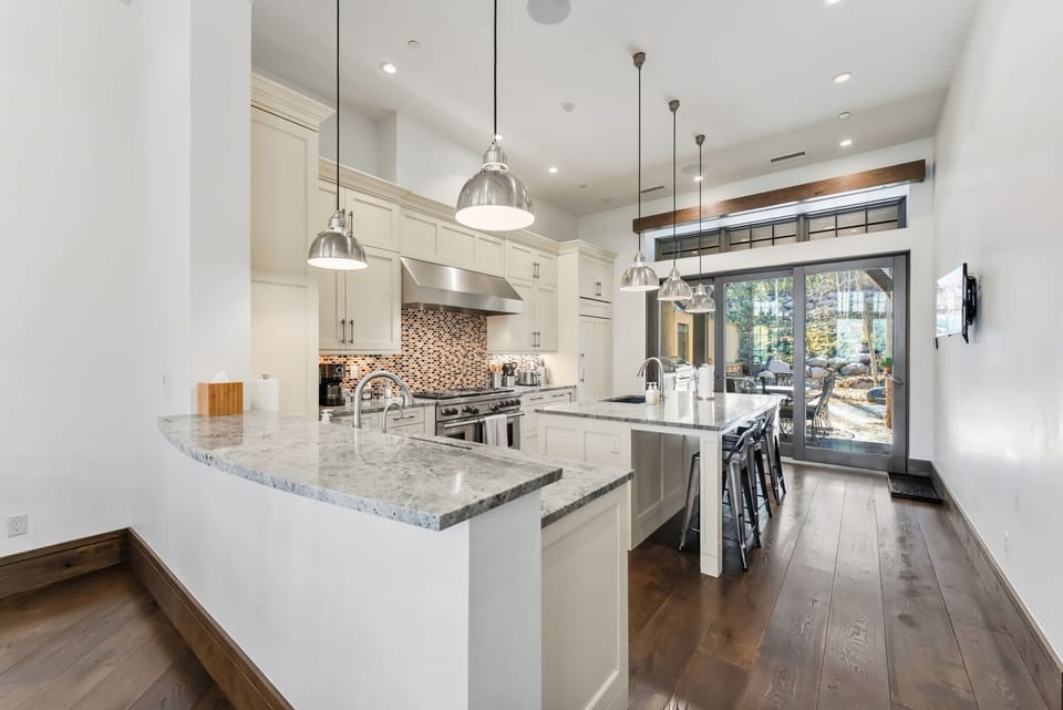 Kitchen: Main floor, Sub-Zero fridge, Wolf range, Keurig and drip coffee maker, Crockpot, toaster, cooking utensils, tableware