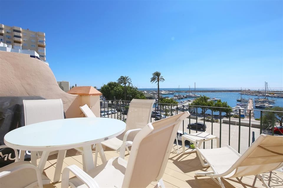 Private sunny terrace facing south with outdoor dining area and sea views