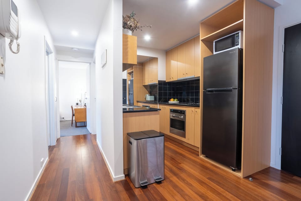 Hallway to Bedroom and Kitchen Area
